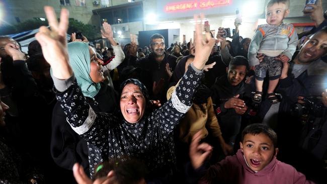 Palestinians react to news on a ceasefire deal with Israel, in Deir Al-Balah in the central Gaza Strip. Picture: Reuters