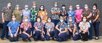 Lismore Base Hospital emergency unit staff in Fun Friday Scrub Club tops donated by Infectious Clothing as a mental health initiative for healthcare workers. Back Row (L-R): Kathy Macnamara, Emma-Jane Davies (NUM 3 ED), Alison Gibson, Kath Shaw, Alice Lehmkuhl, Andy Chandler, Leesa Simmons, Hannah Short, Tanya Yager, Donna Kylstra, Lydia BolziccoFront Row (L-R): Stephanie Emery, Sally Thompson, Nicole Eather, Jenny Thompson, Lee Haslau, Carli Malcolm, Olivia Ledingham.