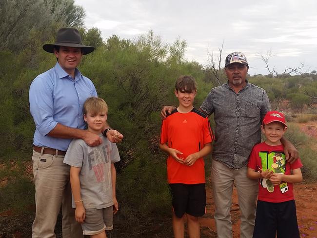 Kyam Maher with his sons and the director of administration in the APY Lands, Rex Tjami in 2015.