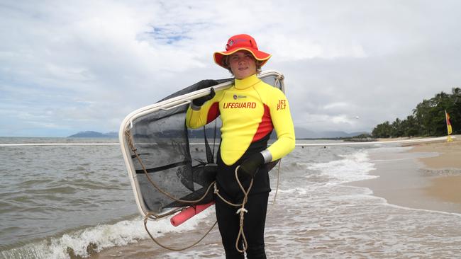 Cairns Lifeguard Edward Orchard conducts a jellyfish net drag at the Holloways Beach stinger net. Picture: Stewart McLean