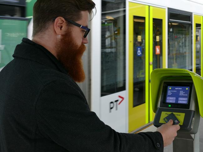 A new myki Quick Top Up machines in action at Domain Interchange.