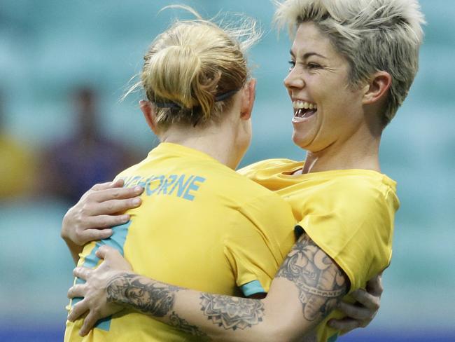 Michelle Heyman and Clare Polkinghorne celebrate the Matildas’ big win.