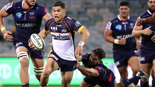 Noah Lolesio makes a charge against the Rebels. Picture: AFP