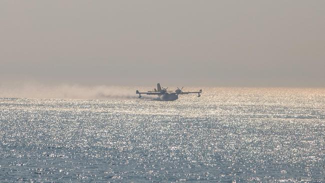 Airtankers take water from the ocean to fight the Palisades fire on January 9. Picture: Getty Images via AFP