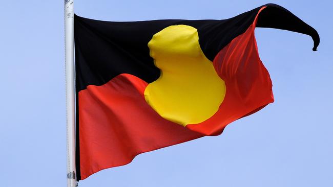 MELBOURNE, AUSTRALIA - NewsWire Photos JANUARY, 15, 2023: Th Aboriginal flag is seen at the Victorian Parliament building.Picture: NCA NewsWire / Luis Enrique Ascui