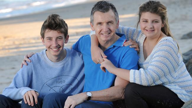 McAvaney with his son Sam, 16, and daughter Alex, 14 at Glenelg Beach.