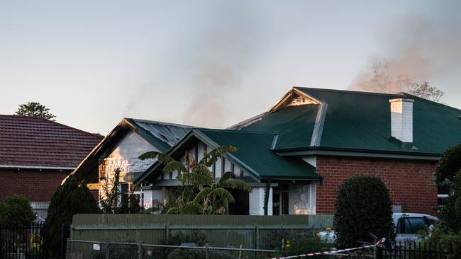 Smoke seen rising from the duplex more than an hour after the fire broke out. Pic: AAP Image/Morgan Sette