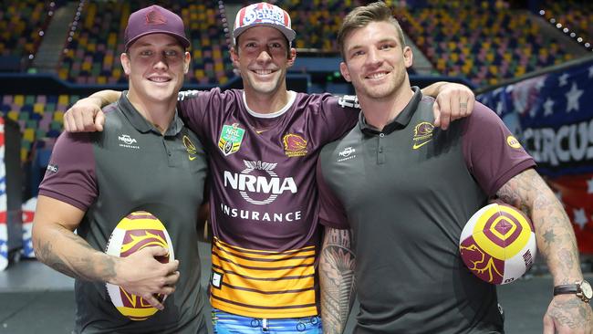 Brisbane Broncos players Jarrod Wallace and Josh McGuire with Nitro Circus legend Travis Pastrana yesterday. The Nitro Circus is at the Brisbane Entertainment Centre this weekend. Picture: Jono Searle.