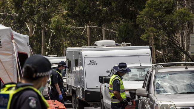 Police officers patrol and check for entry permits to Victoria at a border checkpoint on December 29 last year. Picture:Getty Images