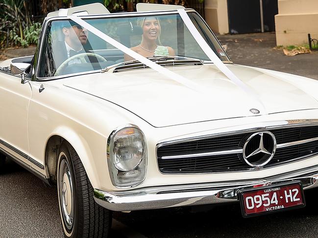 Just married: The loved up duo leave the ceremony. Picture: Ian Currie