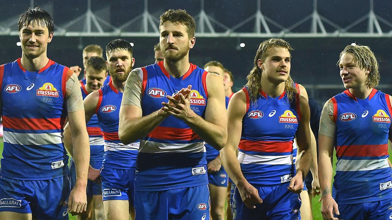 Marcus Bontempelli leads his Bulldogs teammates off UTAS Stadium after they beat Essendon in the first elimination final. Picture: Getty Images