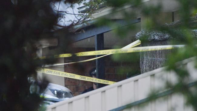 Police at the scene of the Littlehampton property, where one man was shot and another severely wounded with an axe. Picture: Brenton Edwards/AAP