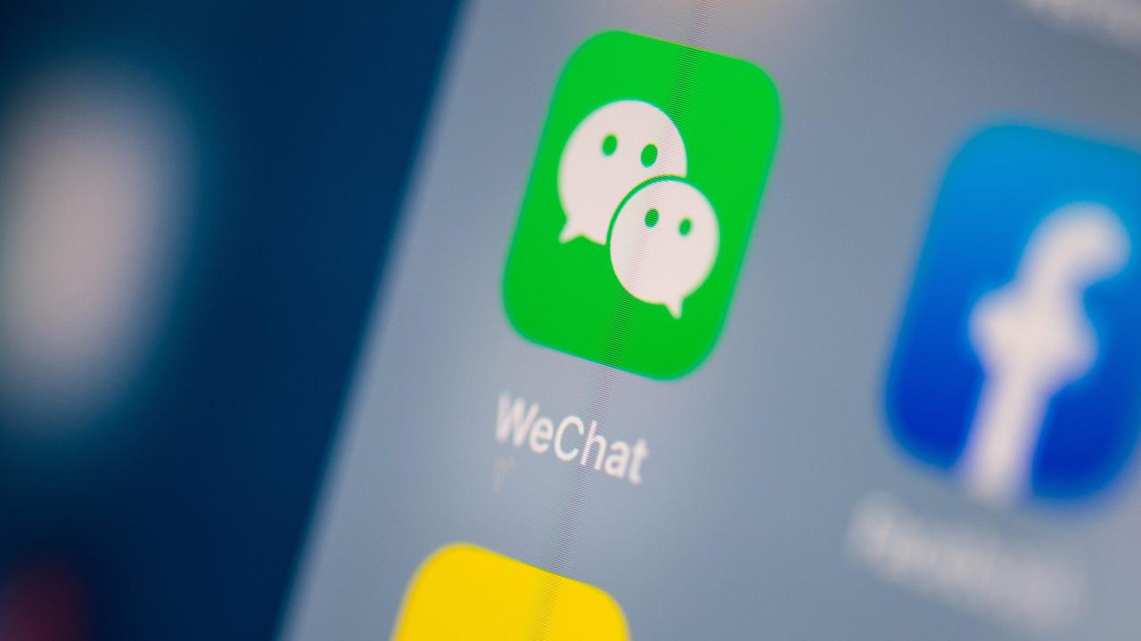 WeChat is widely used by Chinese in Australia and relied on by many with limited English for news and information. (Photo by Martin BUREAU / AFP)
