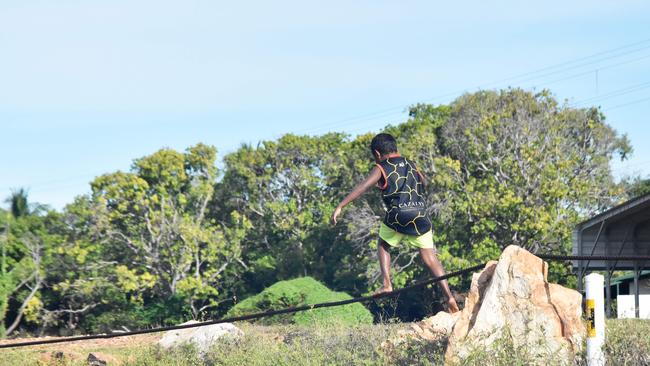 A child plays on the outskirts of Nauiyu/Daly Rive.     Picture: JASON WALLS