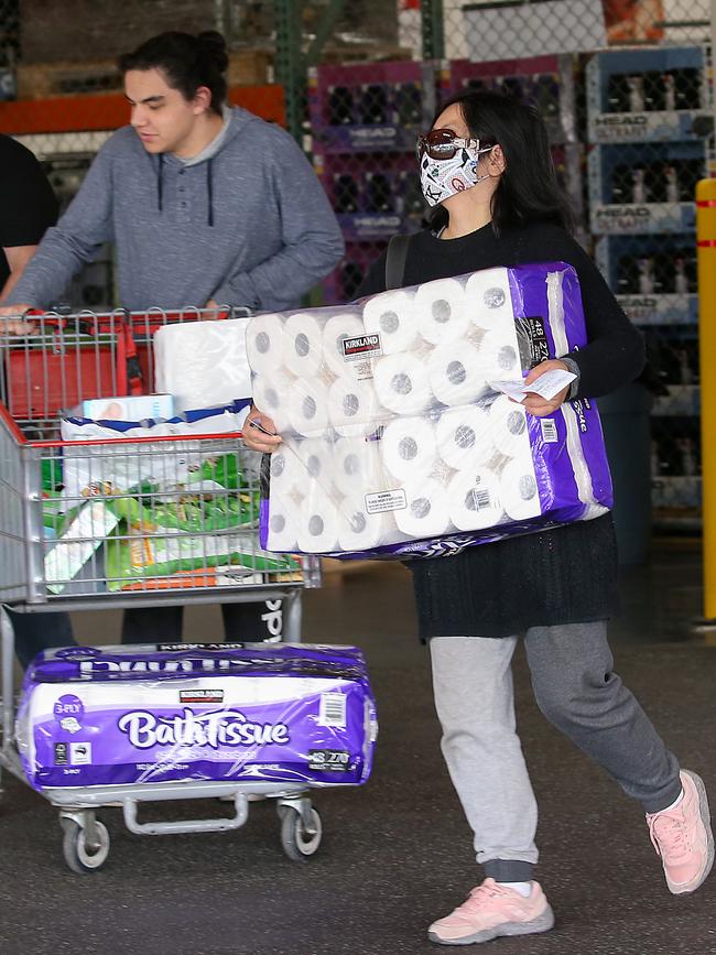 Despite authorities urging people not to stockpile, there was a rush on toilet paper at the giant supermarket in the heart of Melbourne. Picture: Ian Currie