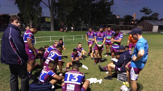 Wavell SHS in a halftime huddle.