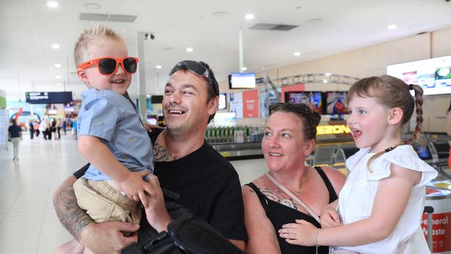 Brad Mifsud arrives from Melbourne and reunites with his family members Shayne, Savannah and Karter at Gold Coast Airport. Picture: Scott Powick