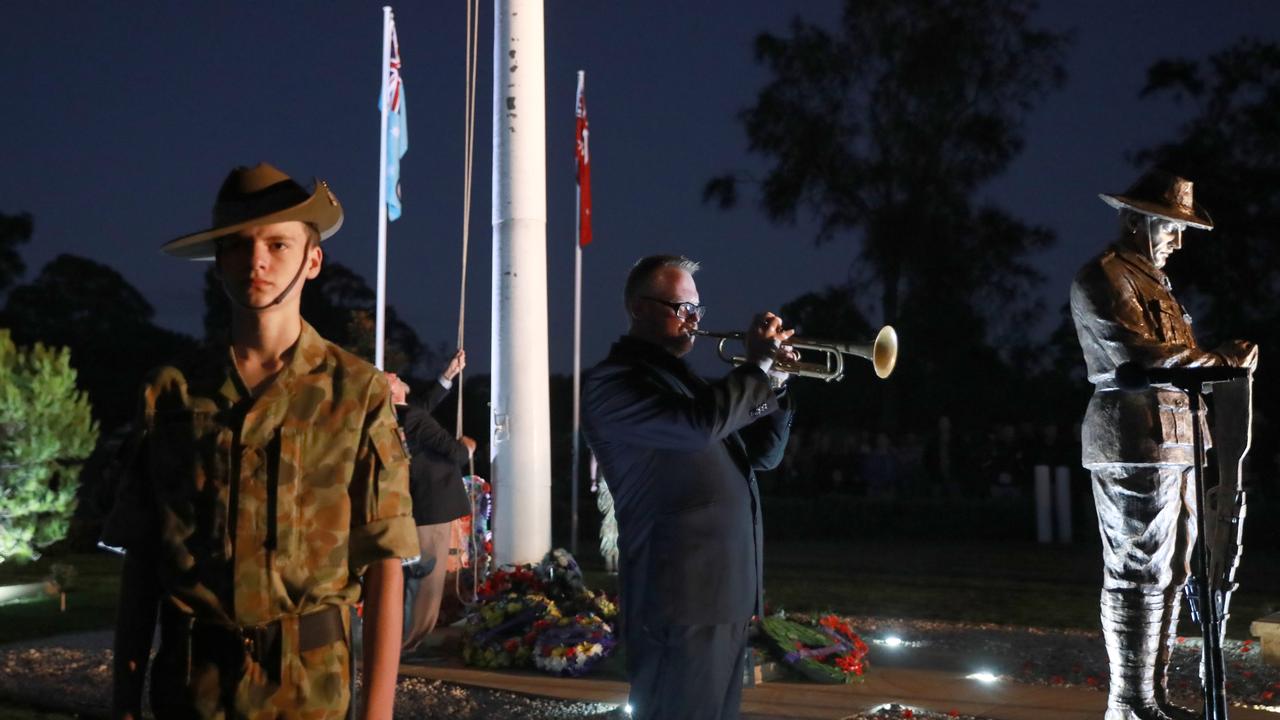 A bugler sounds the Last Post during Anzac Day commemorations at Pinegrove Memorial Park in Minchinbury. Picture: Angelo Velardo