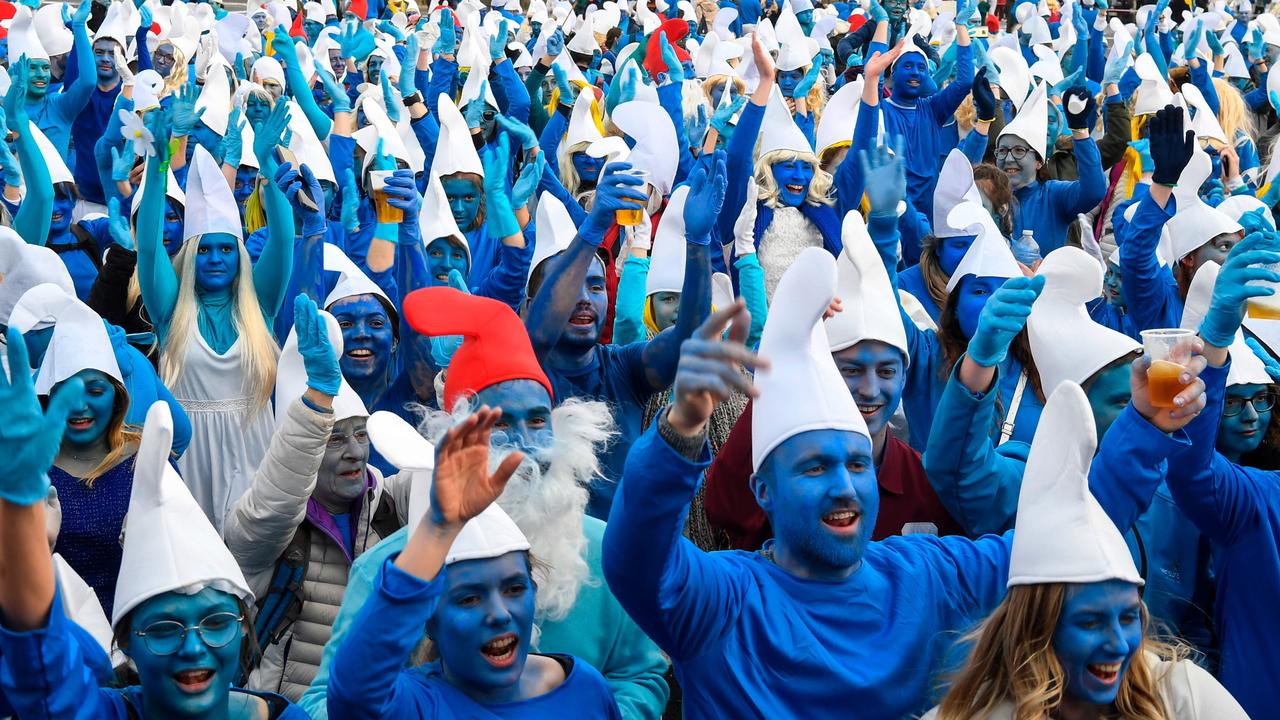 People dressed as comic-book characters Smurfs at a world-record gathering of Smurfs on March 7, 2020, in Landerneau, France, before COVID-19-related restrictions forced people to concentrate on record attempts they could do solo. Picture: AFP