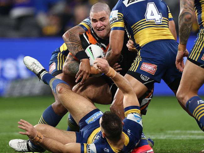 SYDNEY, AUSTRALIA - JULY 23:  Russell Packer of the Tigers is tackled as Ryan Matterson of the Eels falls to the ground during the round 11 NRL match between the Parramatta Eels and the Wests Tigers at Bankwest Stadium on July 23, 2020 in Sydney, Australia. (Photo by Cameron Spencer/Getty Images)