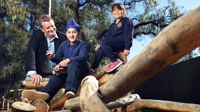 Peter Dunstan from Kilkenny Primary School with students Harjot, 7, and Ella, 6, at the school’s nature play area. Picture: Tom Huntley