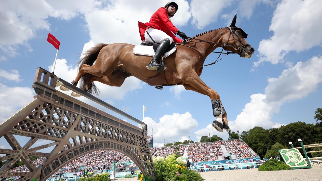 The show jumping team final: Germany's Philipp Weishaupt rides Zineday through the course. Photo: Getty Images)