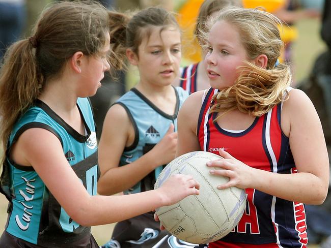 Action at the Curl Curl netball courts. The netball season on the northern beaches looks set to be officially ended this week., Picture: Manly Daily