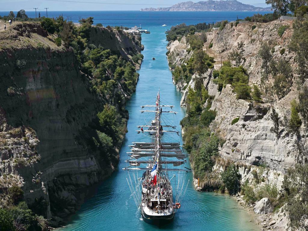 The historic French barque Belem sails through the Corinth Canal, carrying the Olympic flame from Greece to France for the Paris 2024 Games. Picture: Aris Messinis/AFP