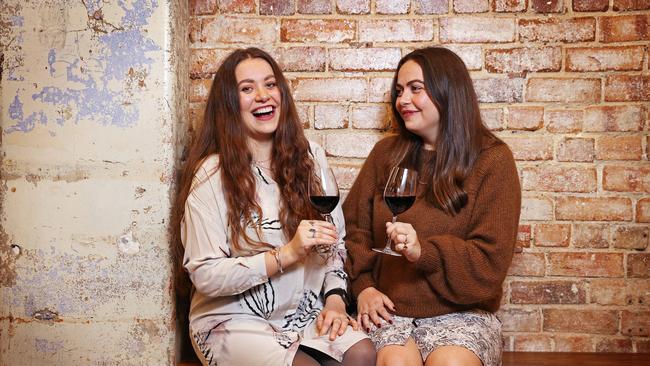 Phoenix De Vierman (right) and sister Anais De Vierman enjoy an Aldi wine. Picture: Sam Ruttyn