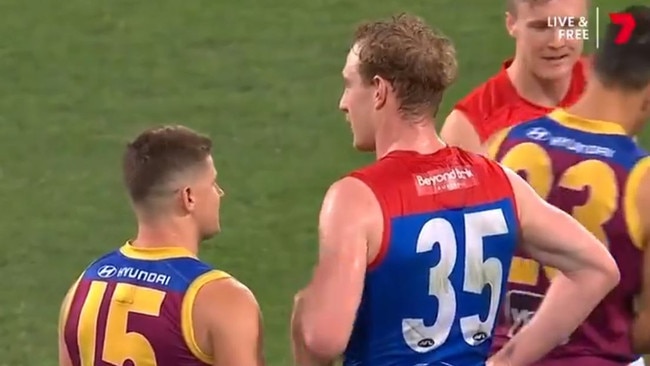 Lions Dayne Zorko approaches Harrison Petty at the end of the game following the Demon being seen in tears at his side’s three-quarter time huddle. Picture: Channel 7