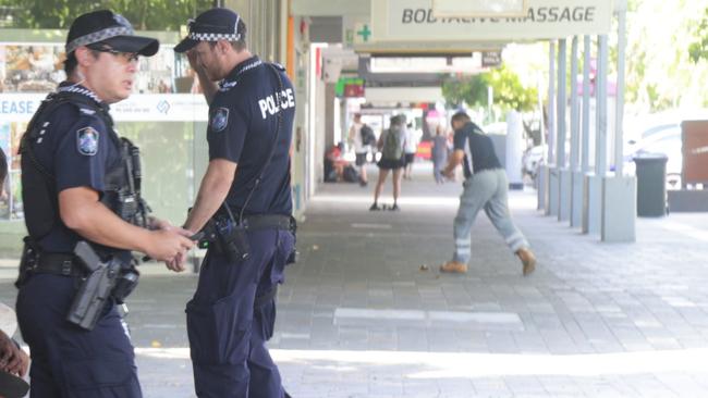 Police confiscate alcohol and move people on from the Shields St pedestrian mall in the Cairns CBD. Picture: Peter Carruthers