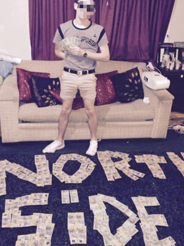 A member of the Northside Gang with the gang's name spelled out in cash. Picture: Instagram