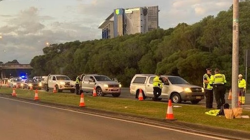 Cars line up at a police checkpoint at Bilinga on the Gold Coast. Picture: Greg Stolz