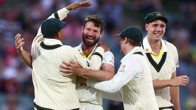 Michael Neser celebrates with teammates after taking the wicket of Kraigg Braithwaite. Picture: Chris Hyde/Getty Images