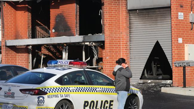 Police investigate a fire at a Marleston gym fire. Picture: AAP/Russell Millard