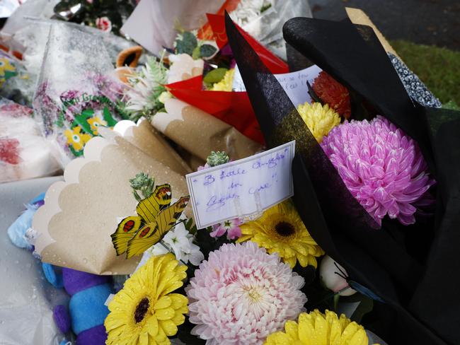 Floral tributes nmount outside the Lalor Park home. Picture: Richard Dobson