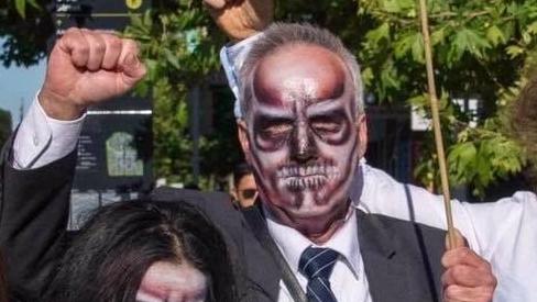 Ian Fox at another climate change protest. He was granted bail in the Adelaide Magistrates Court on Thursday, charged with being unlawfully on premises, property damage and disturbing the peace during a protest in Adelaide's CBD. Photo: