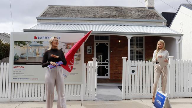 Auctioneer Julia Warren, left, calls for bids at 10 McNicol St, Geelong West.