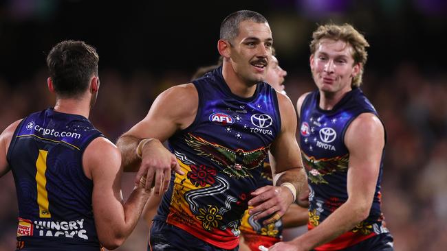 ADELAIDE, AUSTRALIA - MAY 26: Taylor Walker of the Crows celebrates a goal with team mates during the 2024 AFL Round 11 match between Kuwarna (Adelaide Crows) and Waalitj Marawar (West Coast Eagles) at Adelaide Oval on May 26, 2024 in Adelaide, Australia. (Photo by Sarah Reed/AFL Photos via Getty Images)