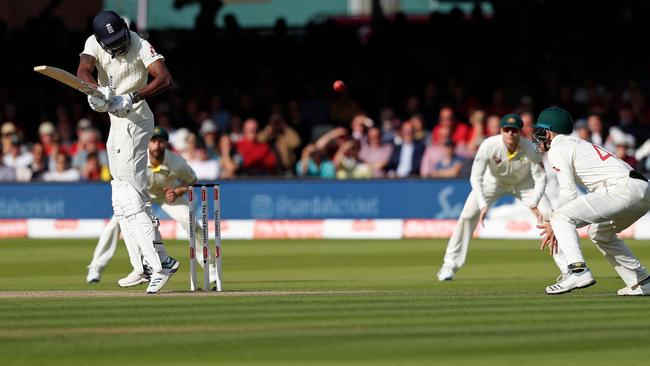 England's Jofra Archer fends off a short ball from Pat Cummins. Picture: AFP