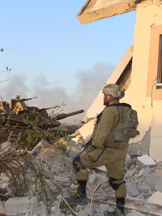 A soldier of the IDF’s 188 Armored brigade behind a house on the outskirts of Gaza City. Picture: Jonathan Spyer