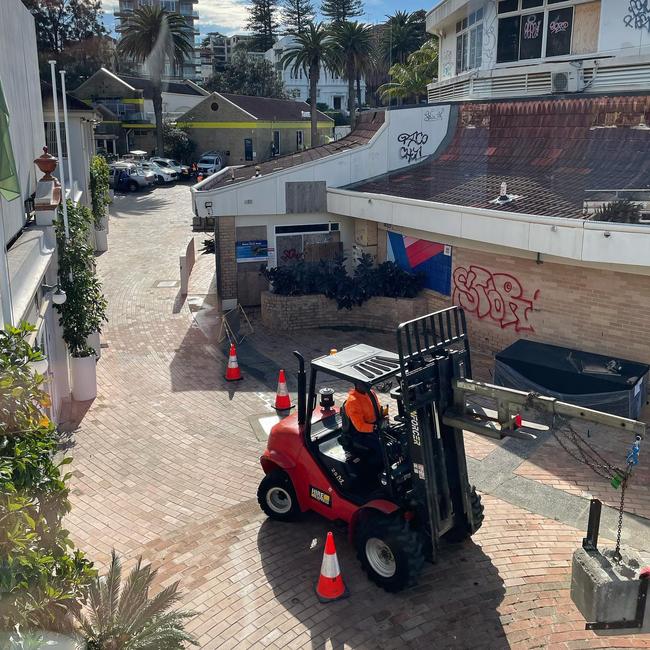 Demolition contractors at the former Sea Life Aquarium building on the western side of Manly Cove. Picture: Facebook (James Griffin MP)