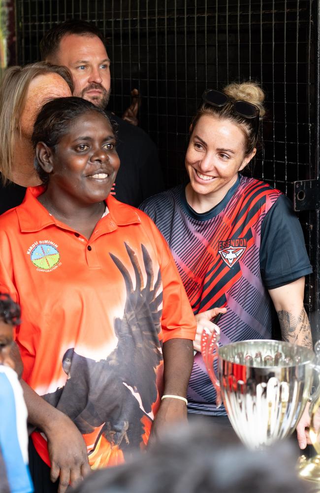 Former Sturt footy player Lauren Taylor (right) was in Wadeye to help run an AFL clinic. Picture: Supplied/John Ross.