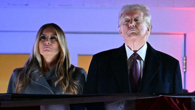 US president-elect Donald Trump and his wife Melania Trump watch fireworks during a reception in his honour on January 18. Picture: AFP