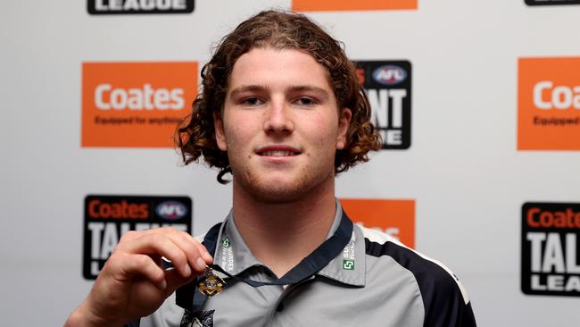 MELBOURNE, AUSTRALIA - SEPTEMBER 24:  Patrick Hughes of the Geelong Falcons poses for a portrait with the Best and Fairest 2023 Morrish Medal, joint winner during the Coates Talent League Boys Grand Final match between Sandringham Dragons  and Eastern Ranges at Ikon Park on September 24, 2023 in Melbourne, Australia. (Photo by Kelly Defina/AFL Photos/via Getty Images)