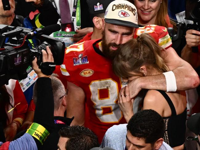 TOPSHOT - US singer-songwriter Taylor Swift and Kansas City Chiefs' tight end #87 Travis Kelce embrace after the Chiefs won Super Bowl LVIII against the San Francisco 49ers at Allegiant Stadium in Las Vegas, Nevada, February 11, 2024. (Photo by Patrick T. Fallon / AFP)