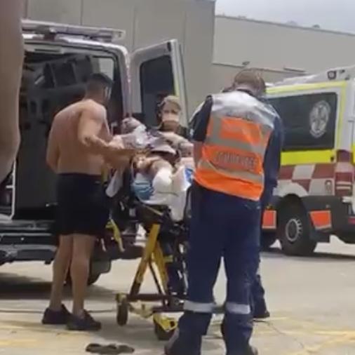 A man shot as he entered the World Gym in Prospect is taken away by NSW Ambulance paramedics. Picture Supplied,