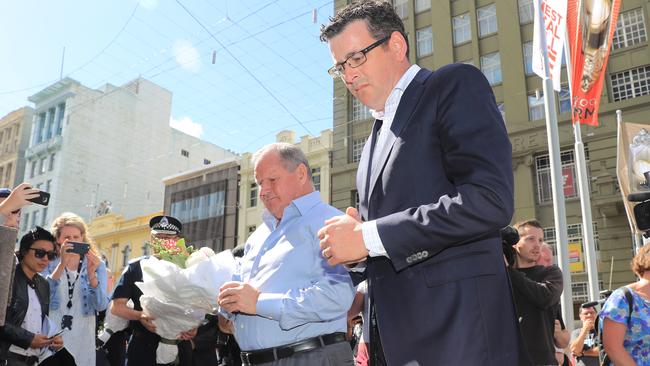 Premier Daniel Andrews and Lord Mayor Robert Doyle lay flowers at Bourke St. Picture: Alex Coppel