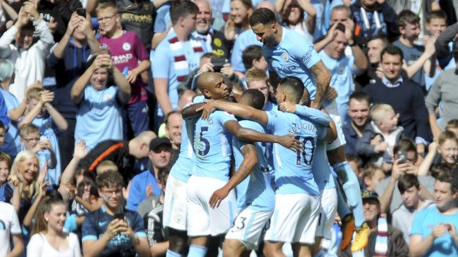 Manchester City's scorer Gabriel Jesus and his teammates celebrate.