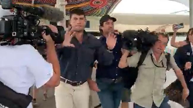 At one point a member of the media can be heard yelling: ‘Get off the cameras, that’s assault!’ Picture: Sky News